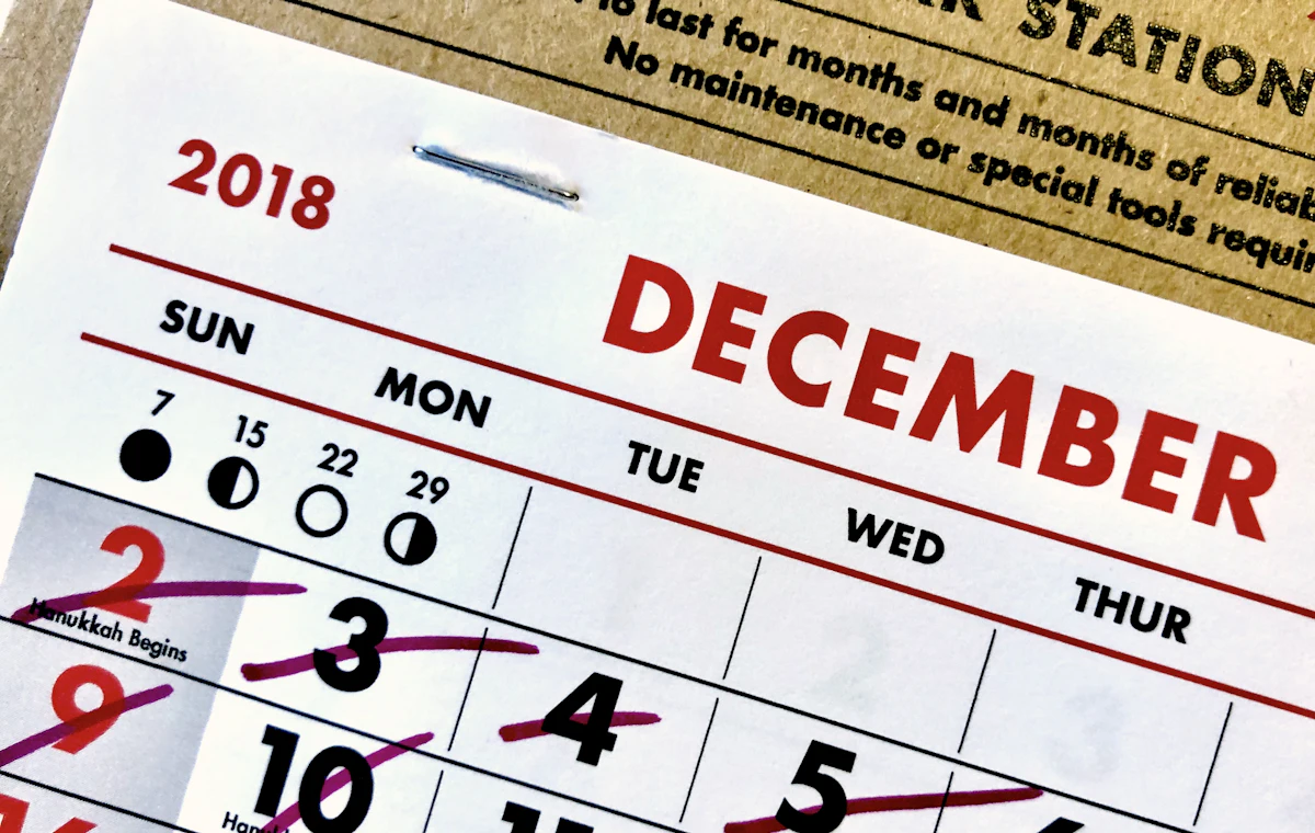 A wall calendar with past days crossed out
